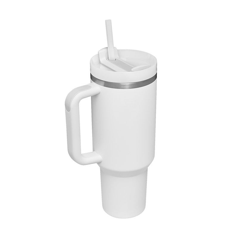 White insulated travel tumbler with handle, lid, and reusable straw on white background