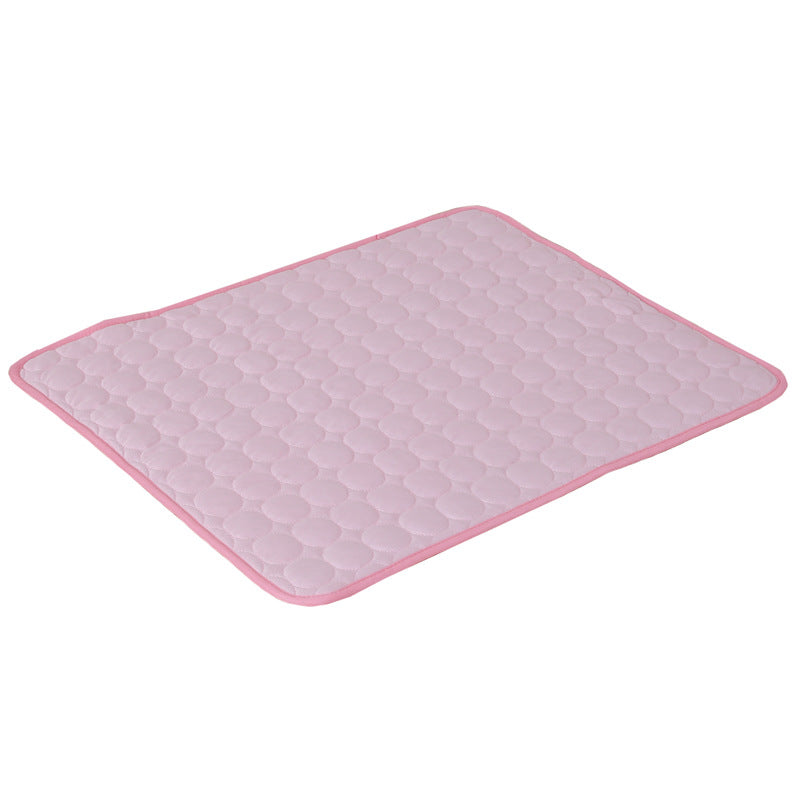 Light pink quilted mat with rounded corners and a subtle geometric pattern