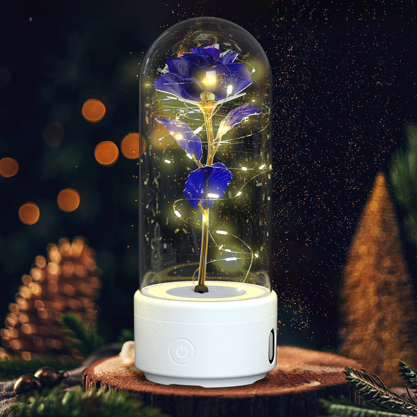 Blue rose in glass dome with LED fairy lights on white base, festive background, home decor