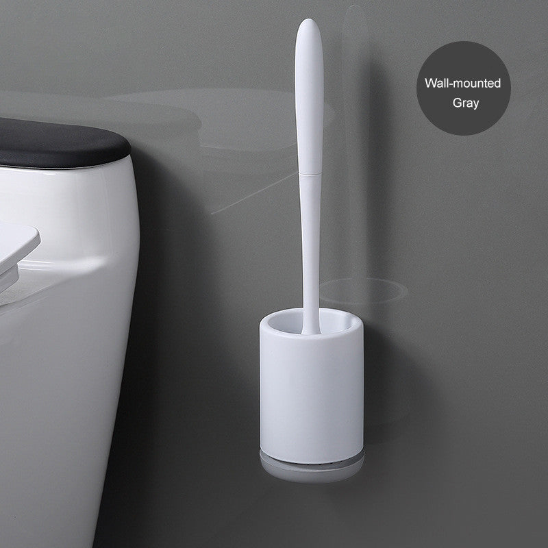 Wall-mounted gray toilet brush and holder next to modern toilet on gray bathroom wall