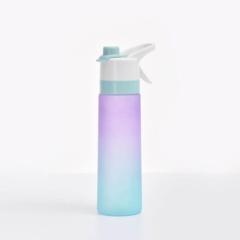 Gradient blue and purple water bottle with flip-top lid on white background