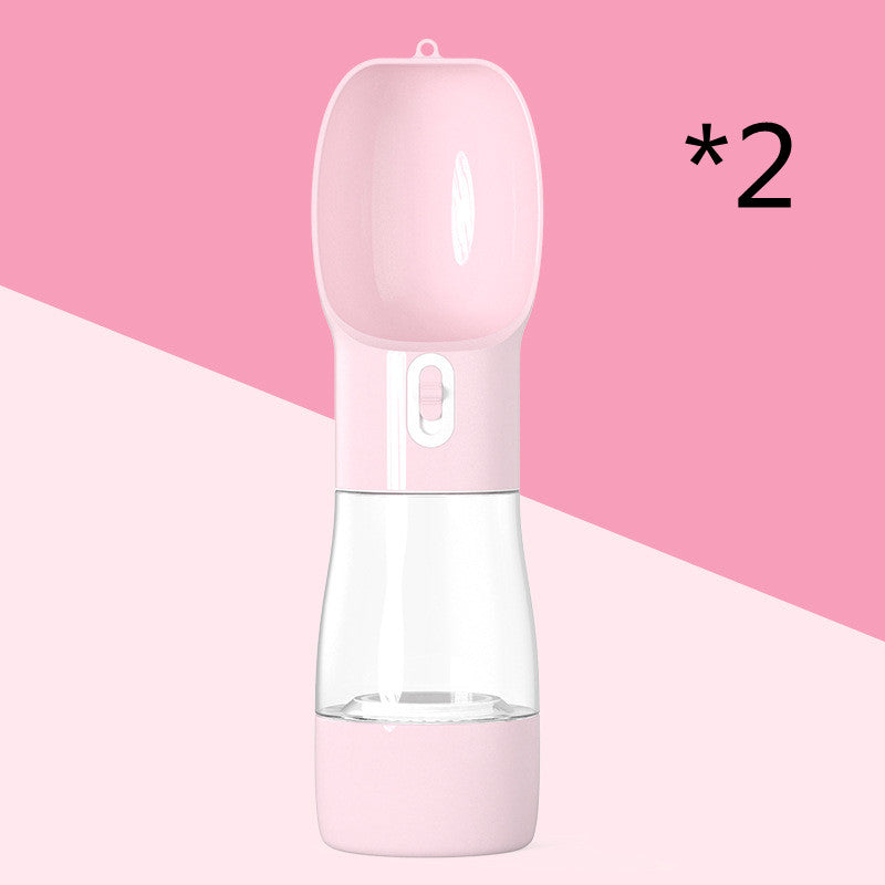 Pink portable pet water bottle with built-in drinking bowl, shown on pink background, set of two.